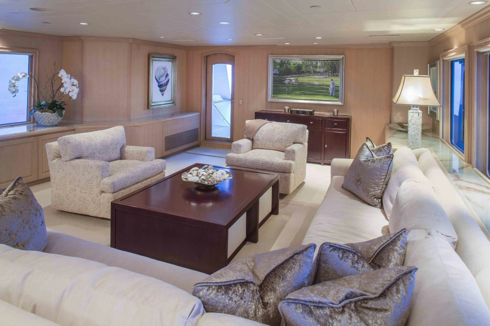 a living room with a couch and a coffee table aboard CHERISH Yacht for Sale