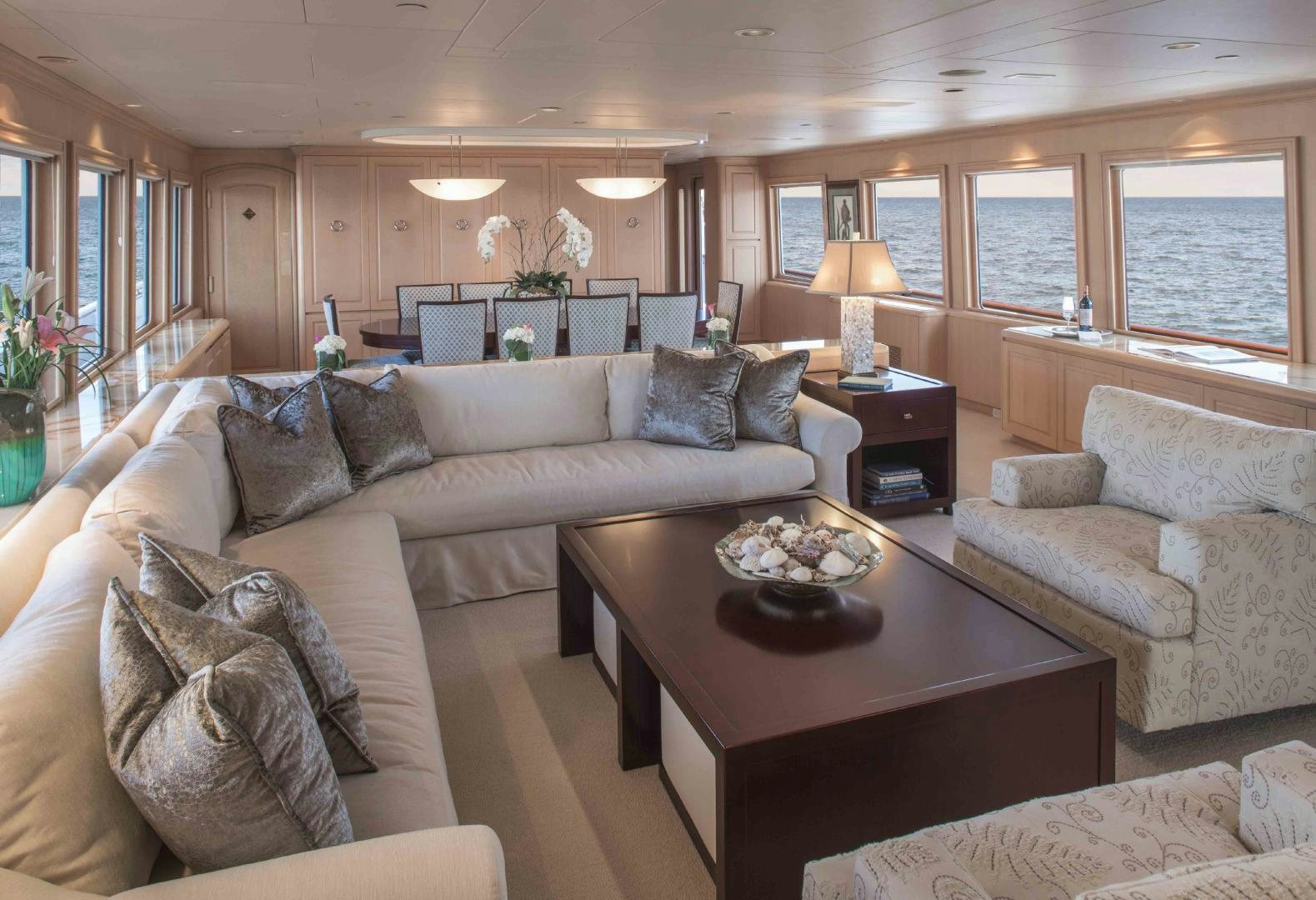 a living room with a couch and a coffee table aboard CHERISH Yacht for Sale