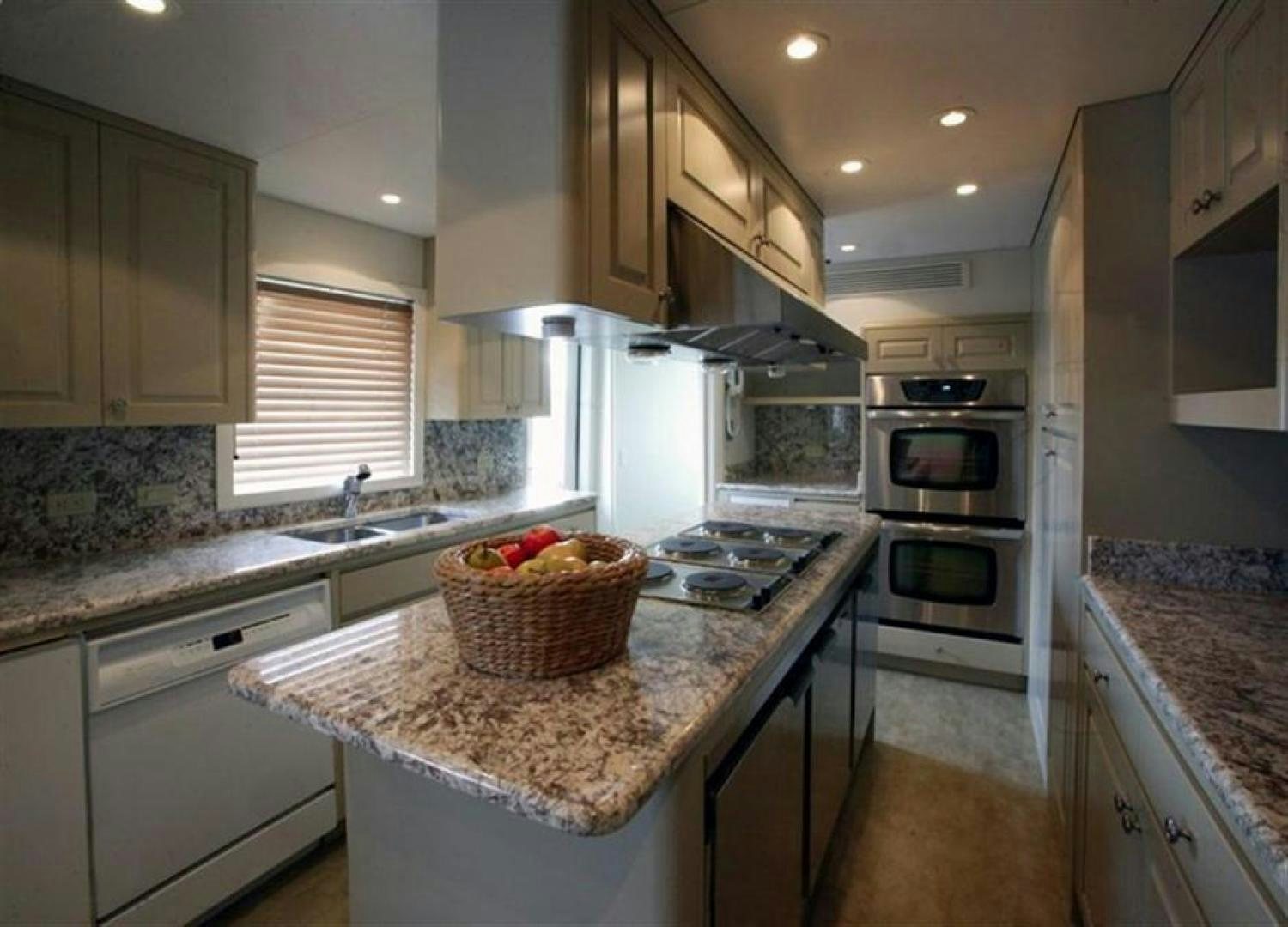 a kitchen with a basket on the counter aboard CHERISH Yacht for Sale