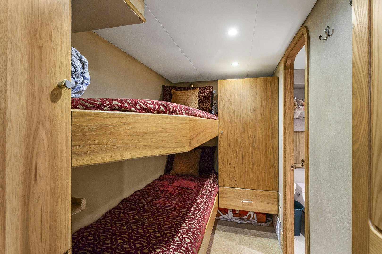 a bedroom with a bed and a mirror aboard ISABELLA Yacht for Sale
