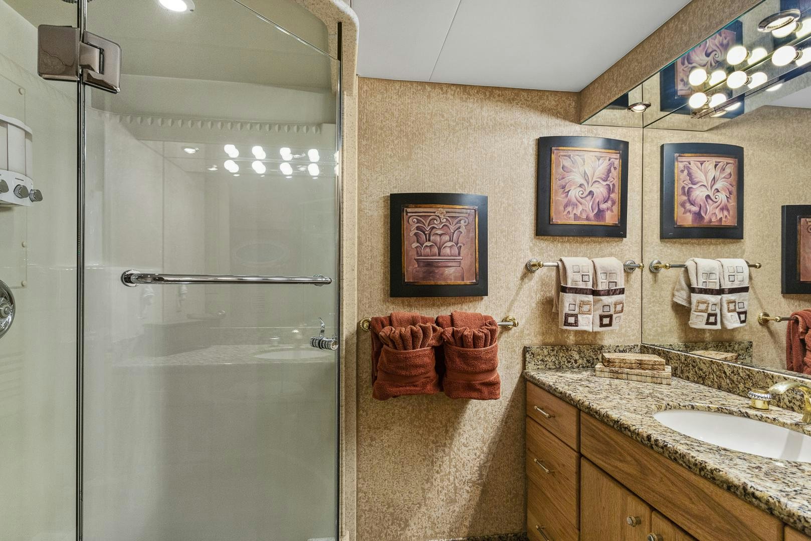 a bathroom with a glass shower aboard ISABELLA Yacht for Sale