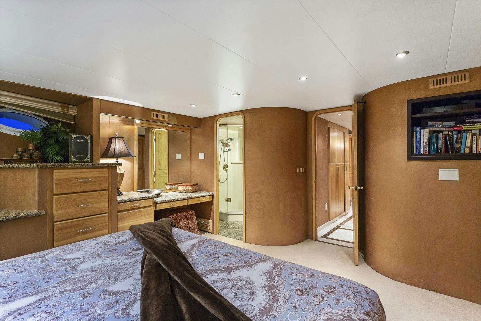 a bedroom with a bed and a desk aboard ISABELLA Yacht for Sale