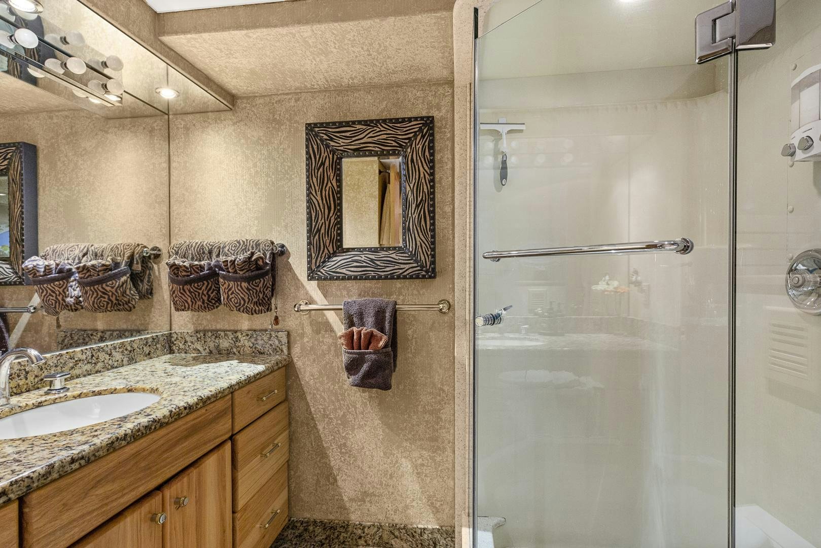 a bathroom with a glass shower aboard ISABELLA Yacht for Sale