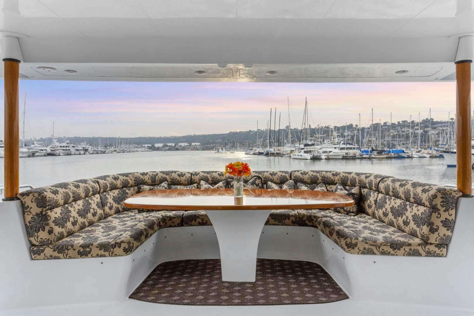a table on a bench overlooking a city aboard ISABELLA Yacht for Sale