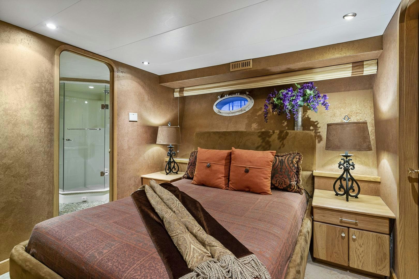 a hotel room with a bed and a lamp aboard ISABELLA Yacht for Sale