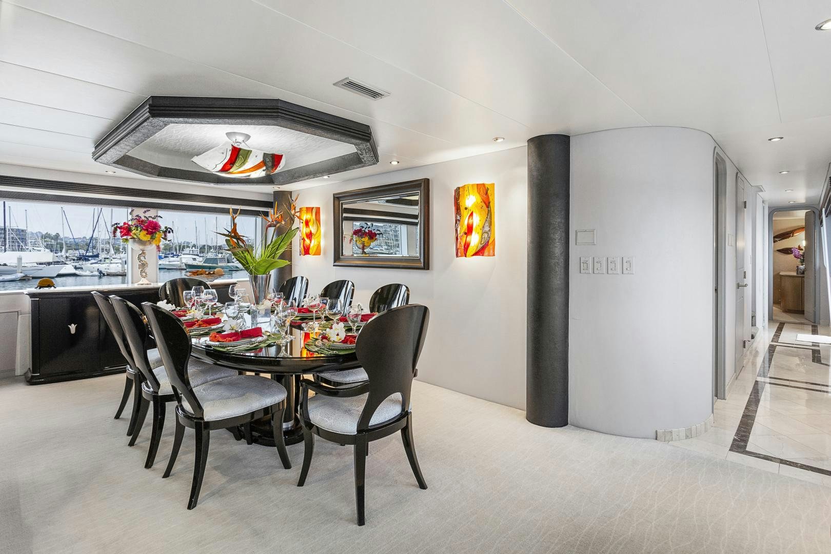 a room with tables and chairs aboard ISABELLA Yacht for Sale