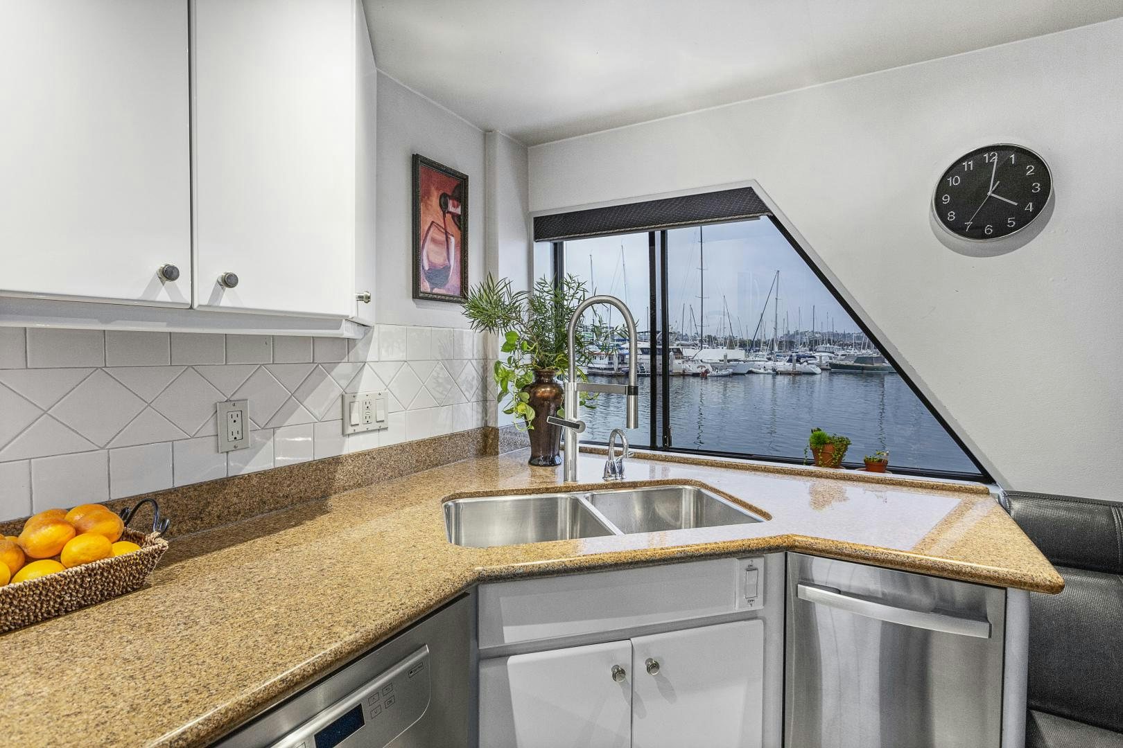 a kitchen with white cabinets aboard ISABELLA Yacht for Sale