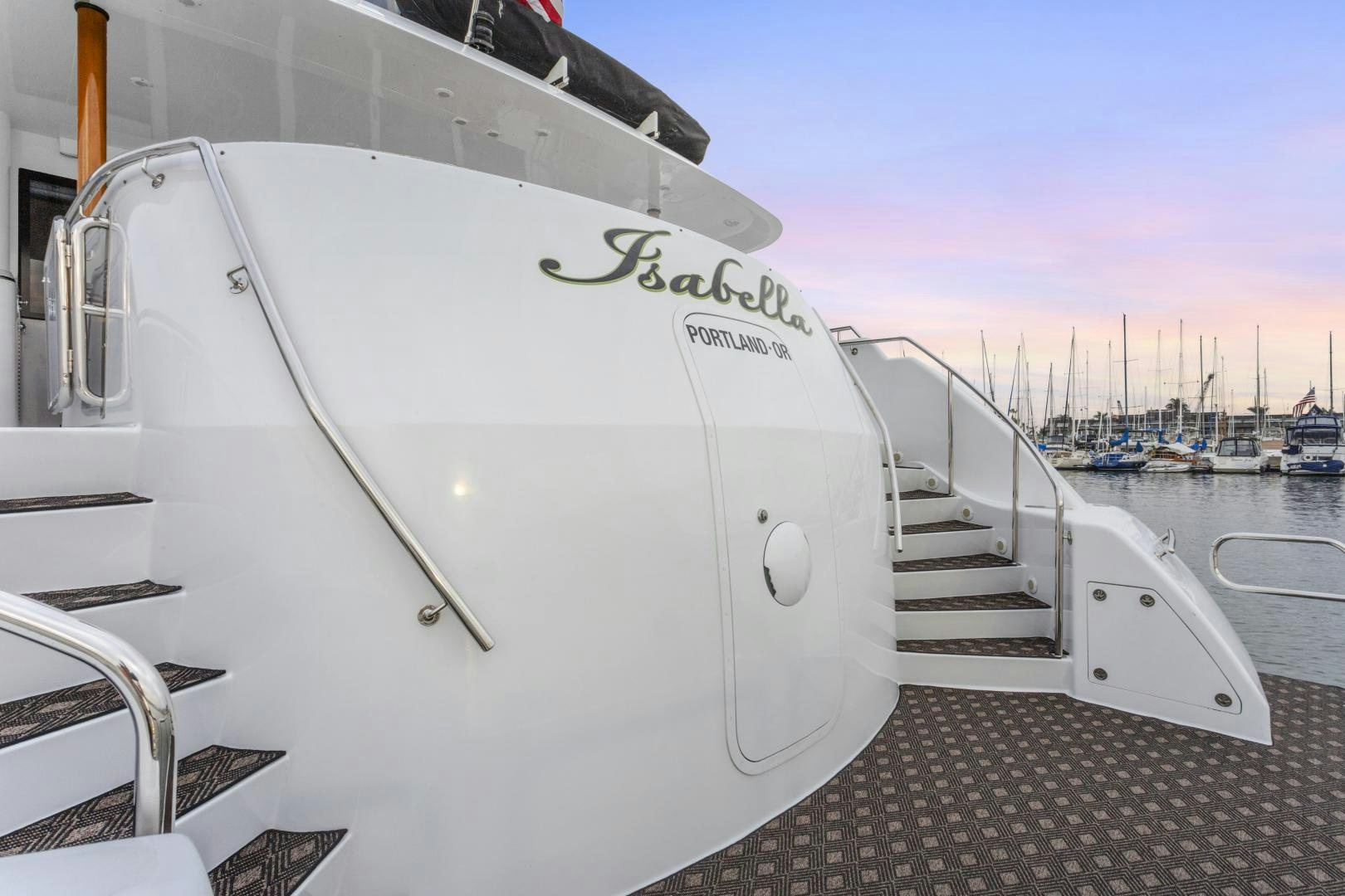 a white boat on a dock aboard ISABELLA Yacht for Sale