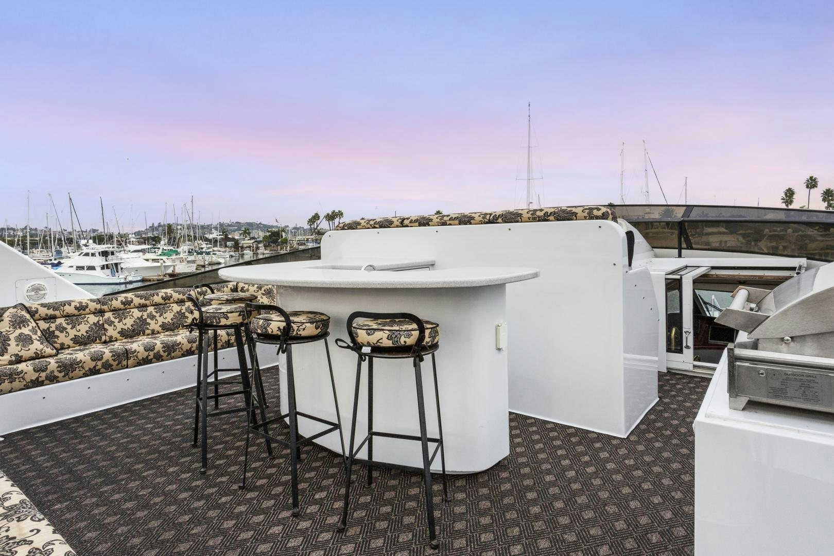 a table and chairs on a patio aboard ISABELLA Yacht for Sale