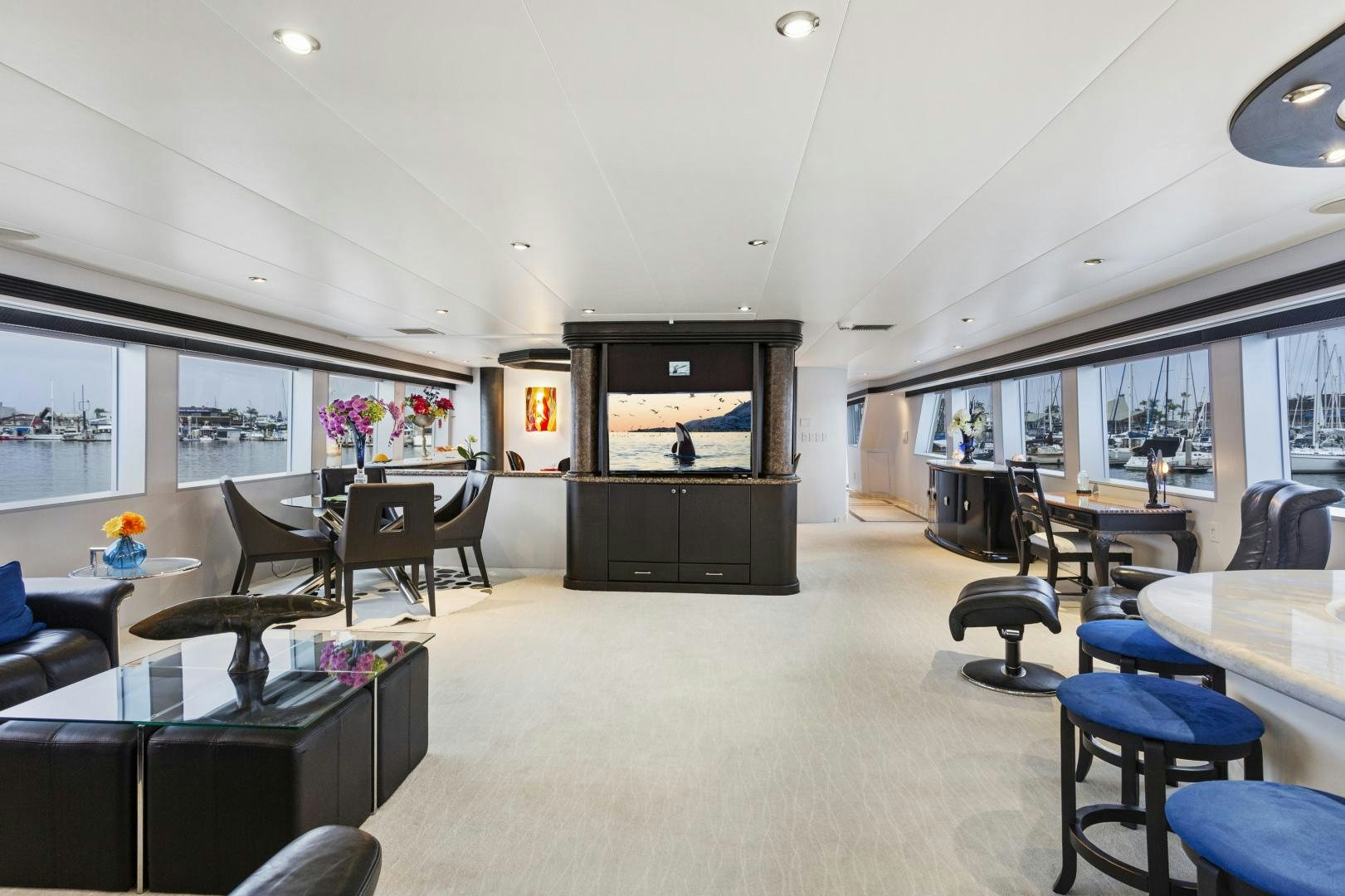 a room with a tv and chairs aboard ISABELLA Yacht for Sale