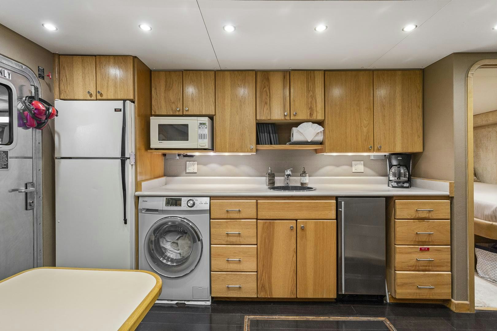a kitchen with wooden cabinets aboard ISABELLA Yacht for Sale