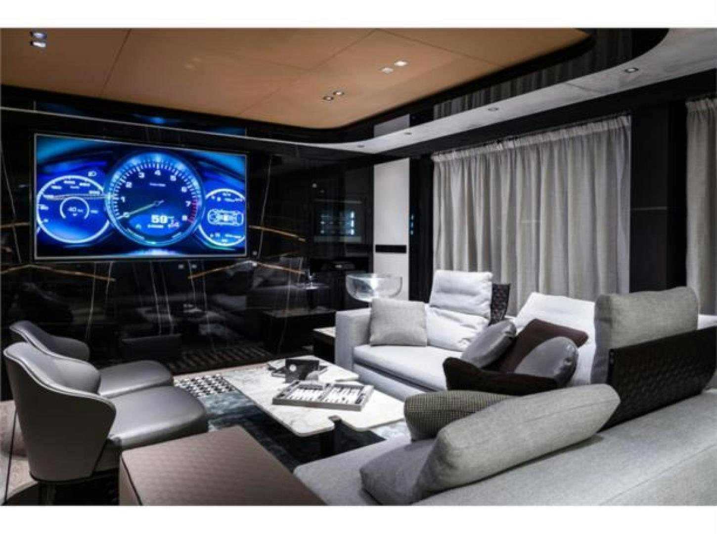 a room with a large screen aboard GTT 115 HYBRID Yacht for Sale