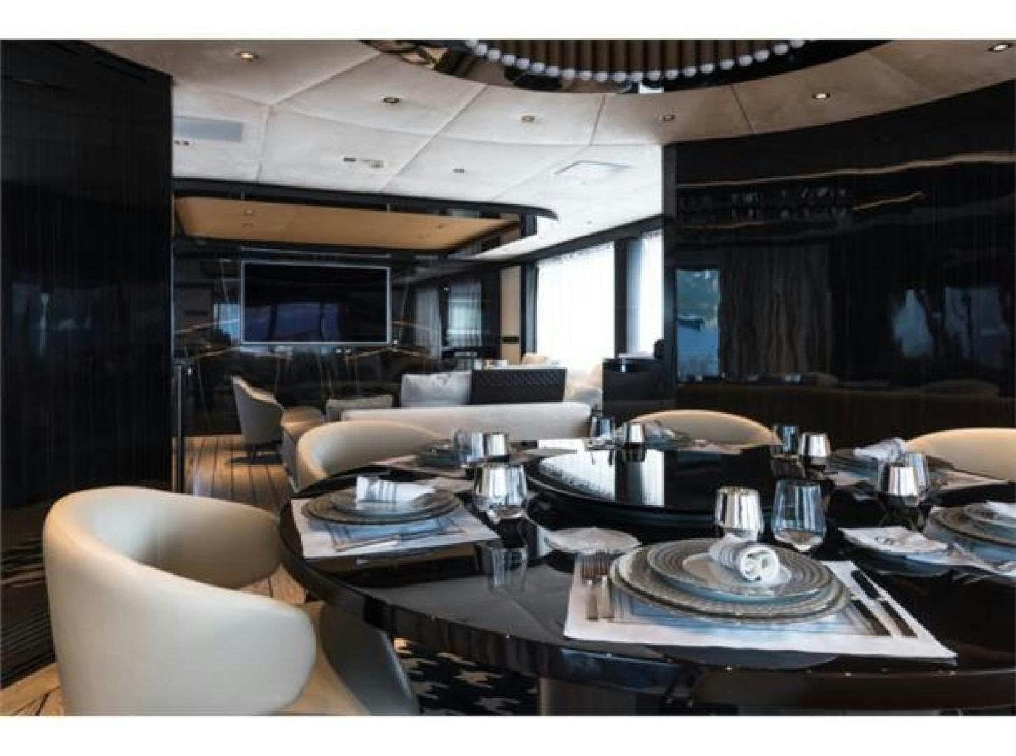 a room with a table and chairs aboard GTT 115 HYBRID Yacht for Sale