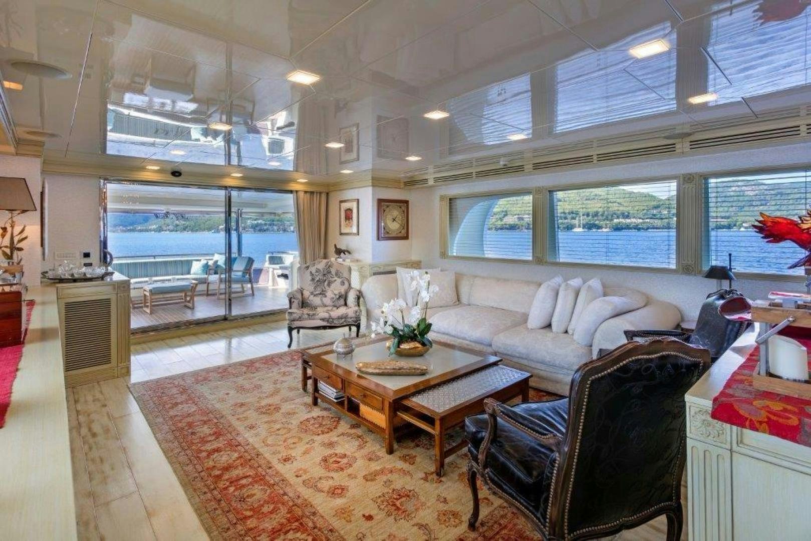 a living room with a large window aboard M&M Yacht for Sale