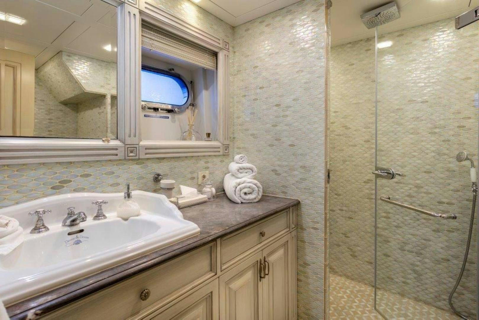 a bathroom with a large mirror aboard M&M Yacht for Sale