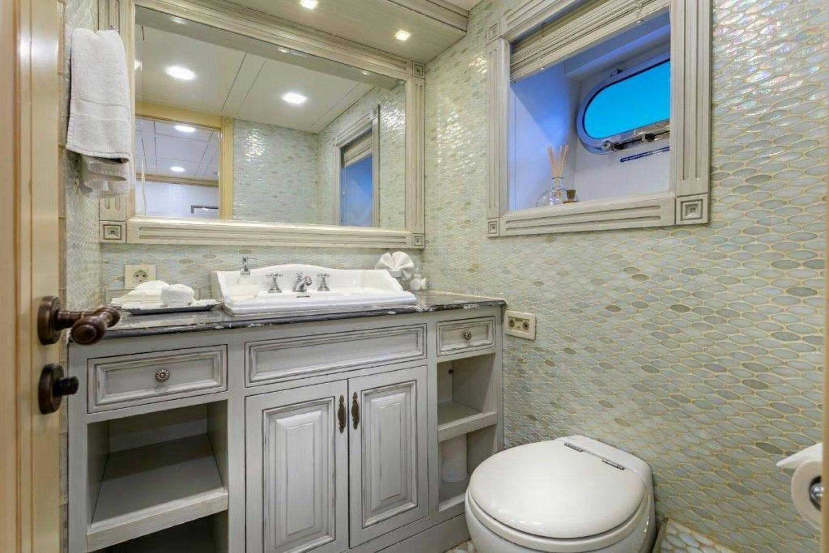 a bathroom with a sink and a toilet aboard M&M Yacht for Sale