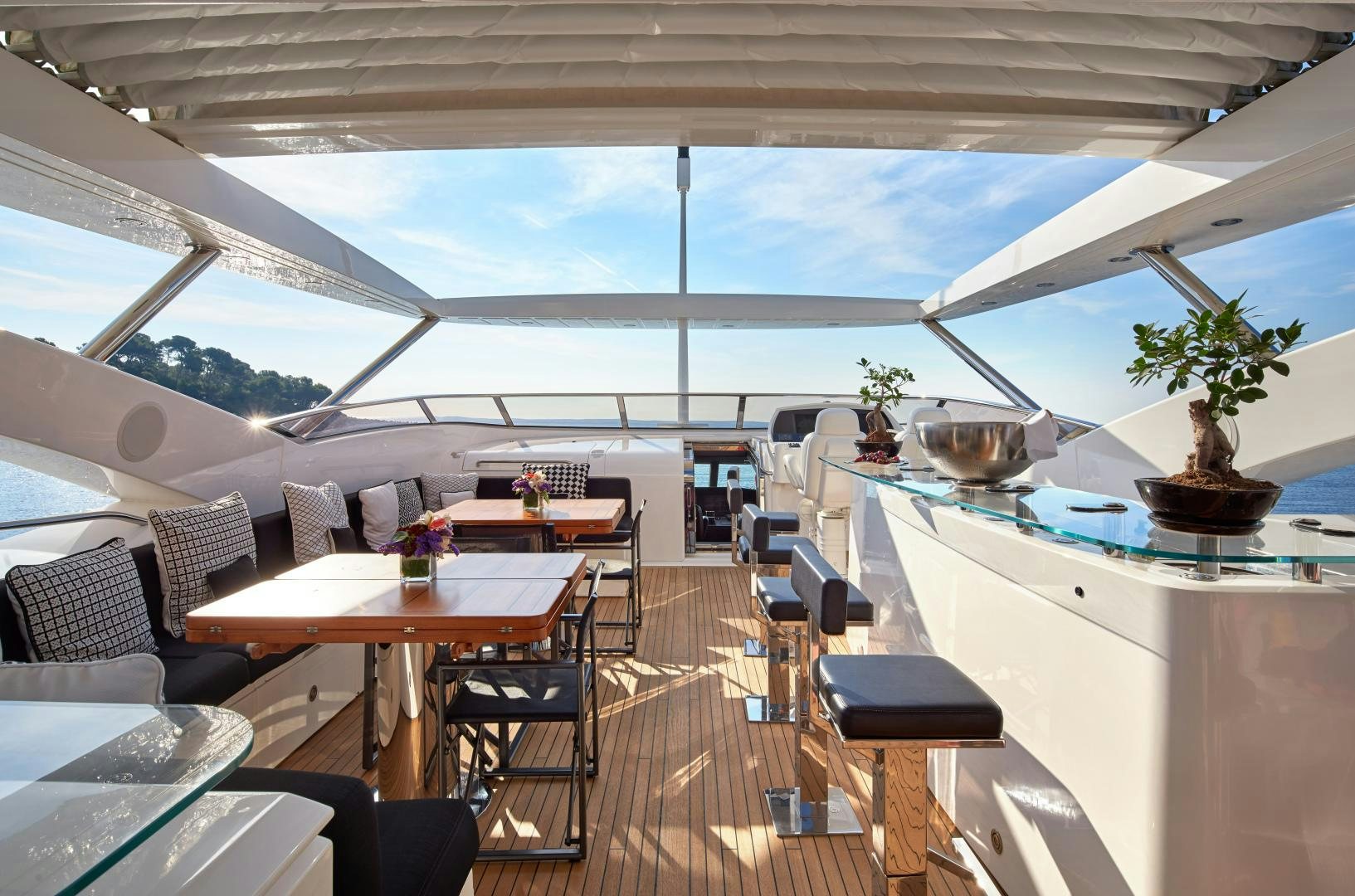 a room with tables and chairs aboard BLACK AND WHITE Yacht for Sale