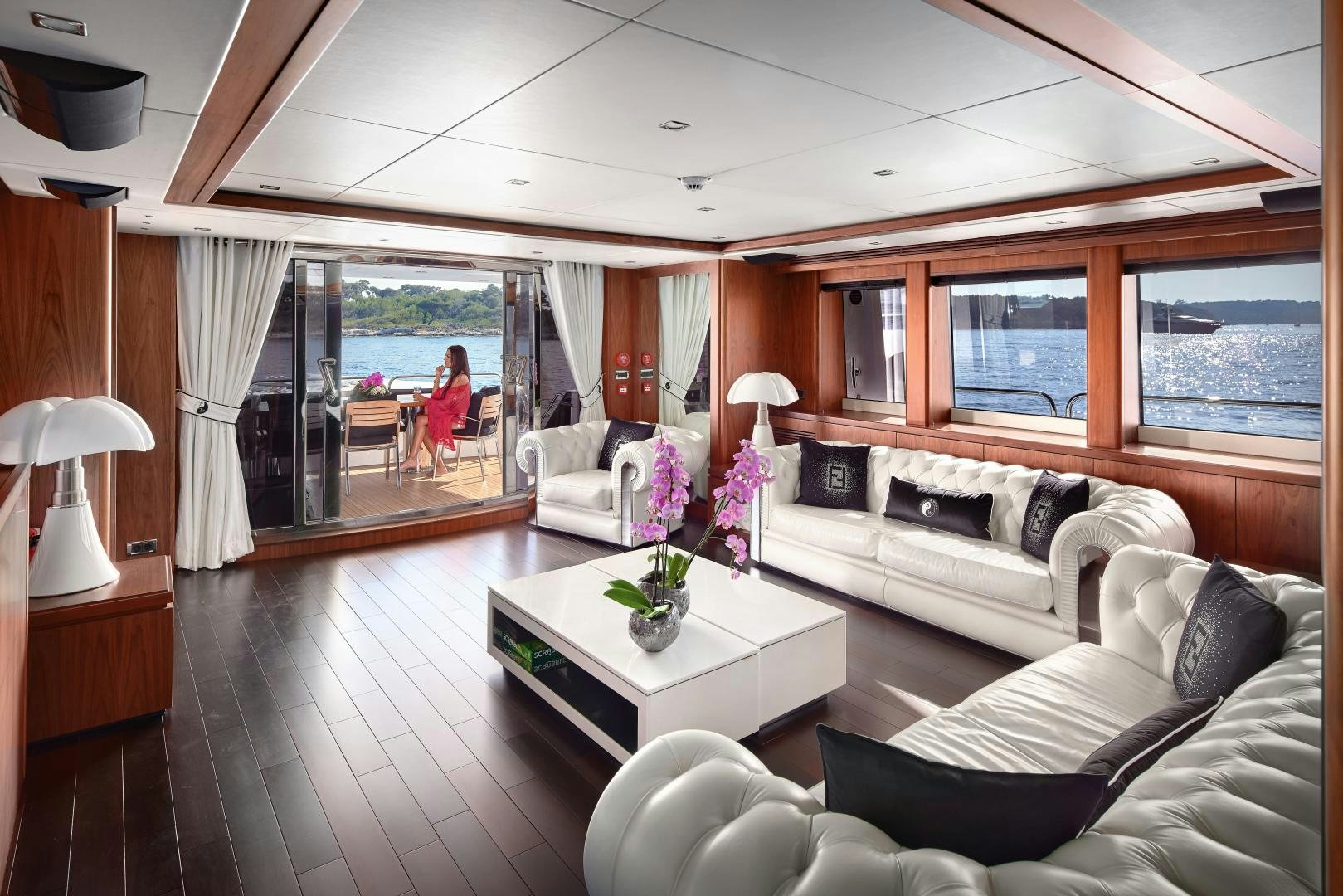 a living room with a large window aboard BLACK AND WHITE Yacht for Sale