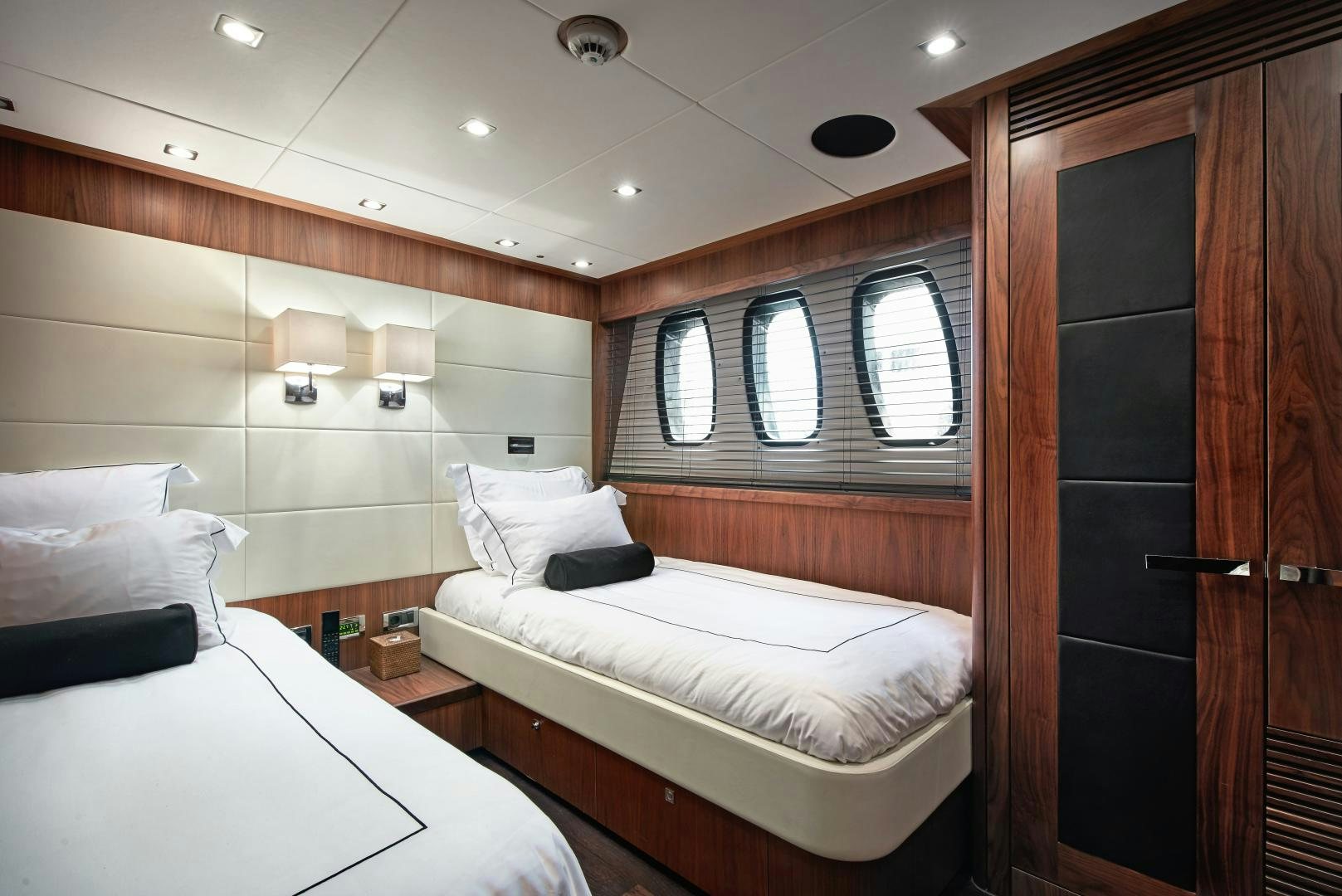 a room with two beds aboard BLACK AND WHITE Yacht for Sale