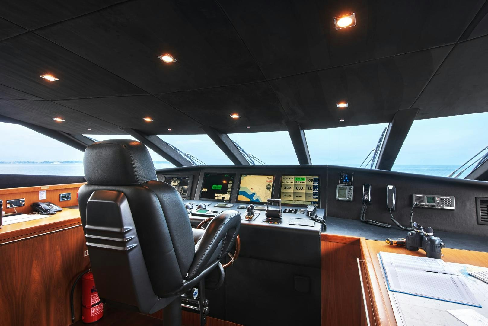 inside of a vehicle with seats and screens aboard BLACK AND WHITE Yacht for Sale