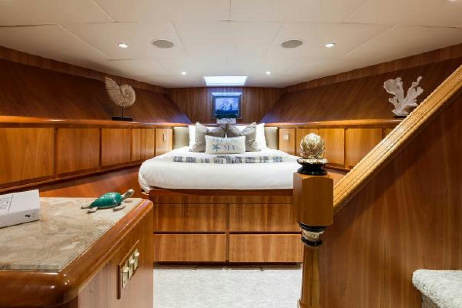 a room with wooden furniture aboard IL CAPO Yacht for Sale