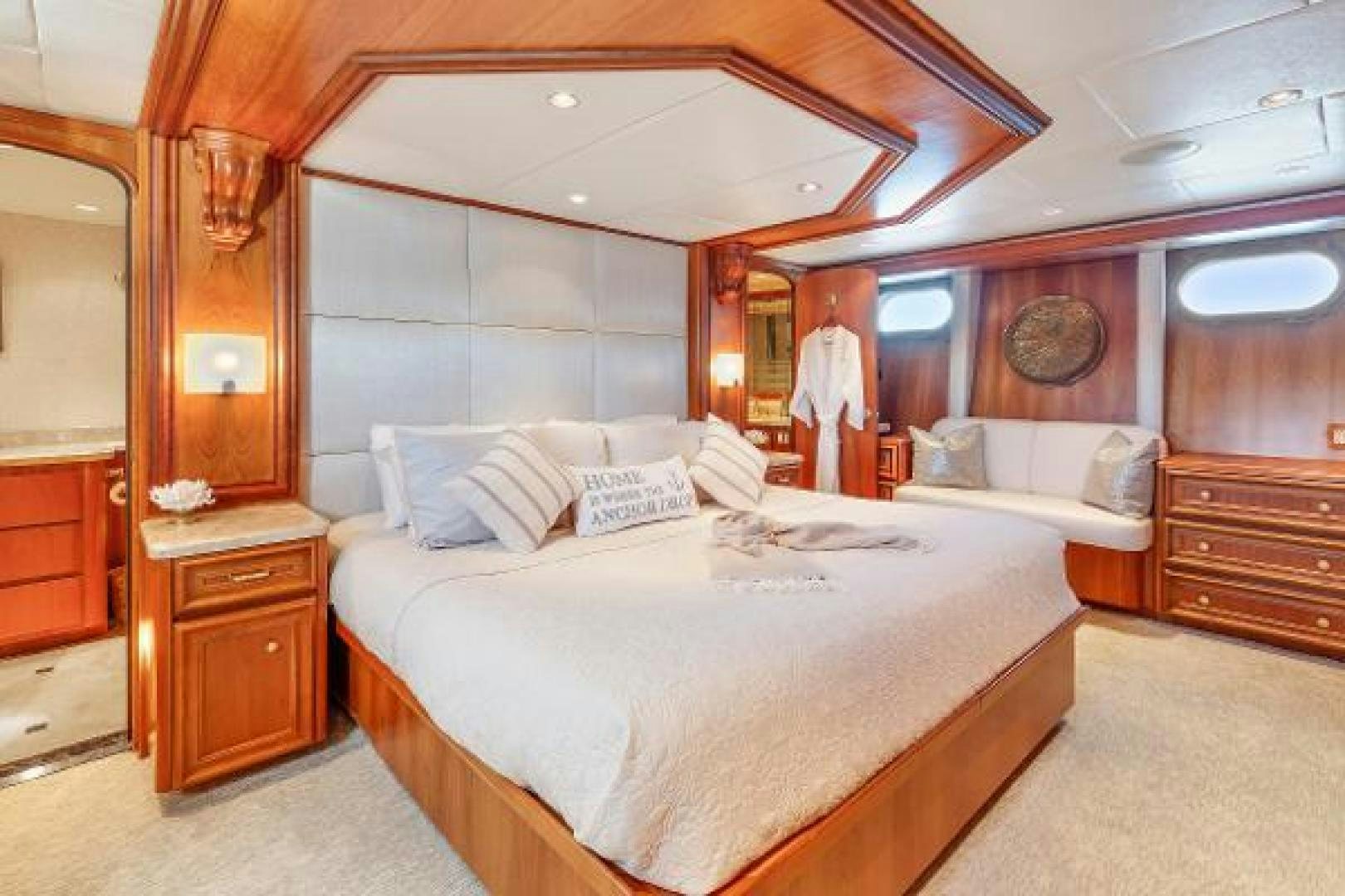 a room with a bed and a dresser aboard IL CAPO Yacht for Sale