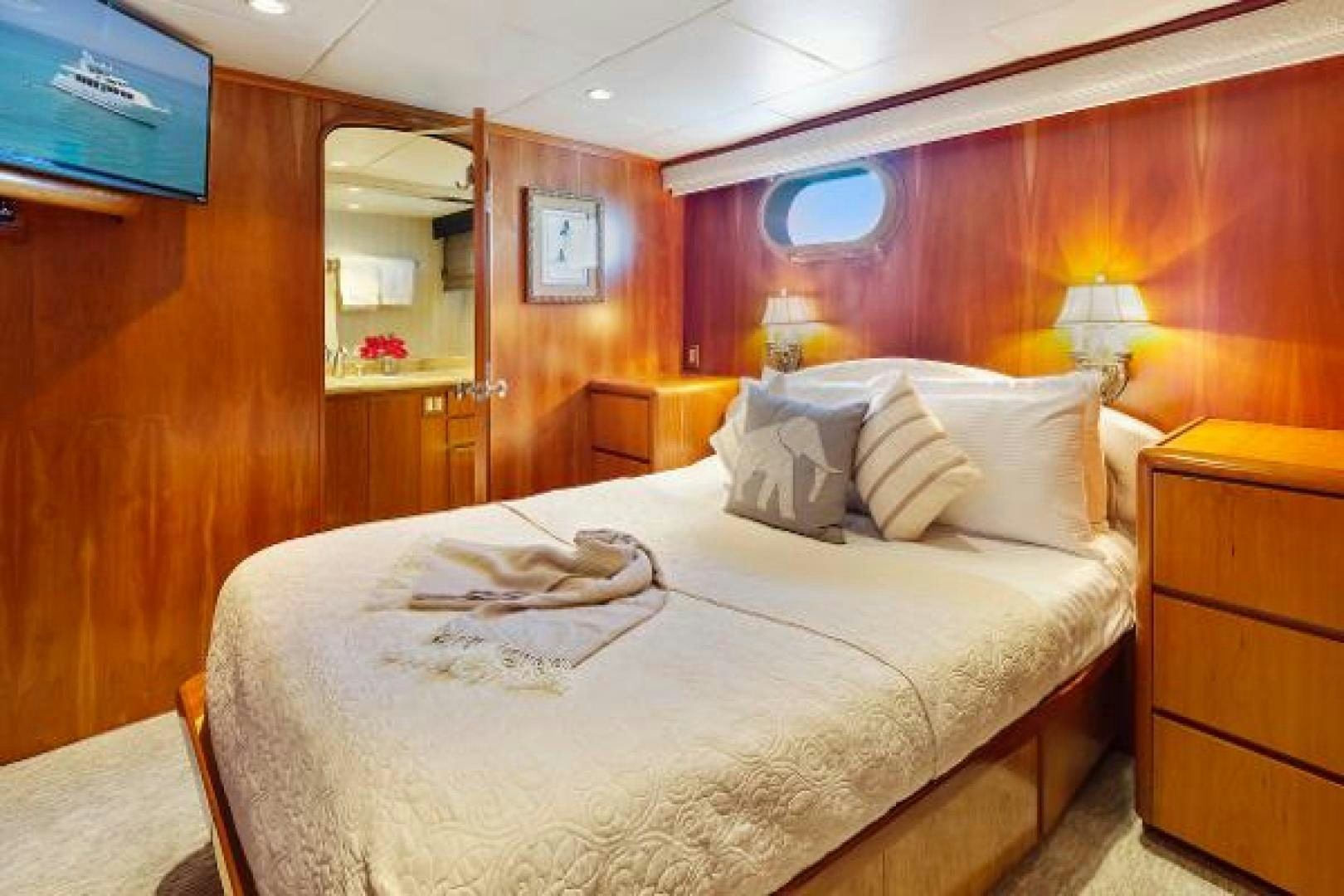 a bed in a room aboard IL CAPO Yacht for Sale