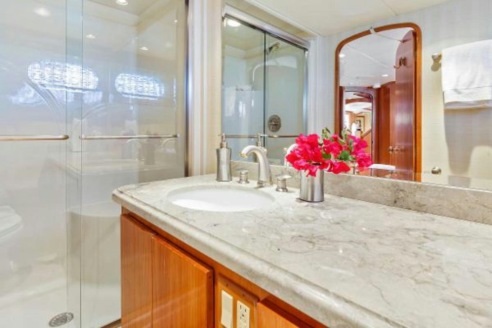 a bathroom with a countertop sink and a mirror aboard IL CAPO Yacht for Sale