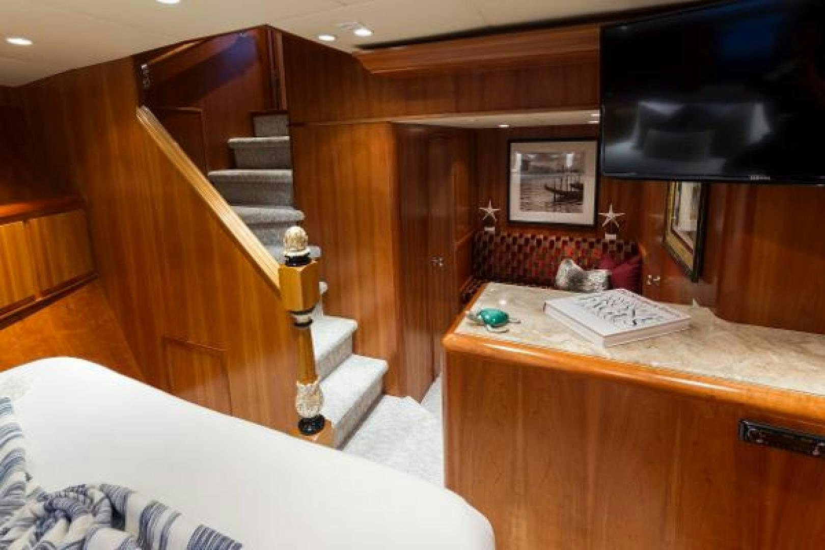 a bedroom with a desk and a bed aboard IL CAPO Yacht for Sale