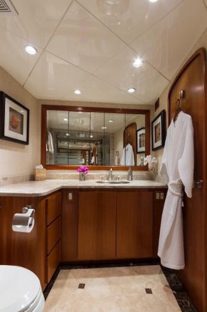 a bathroom with a large mirror aboard IL CAPO Yacht for Sale