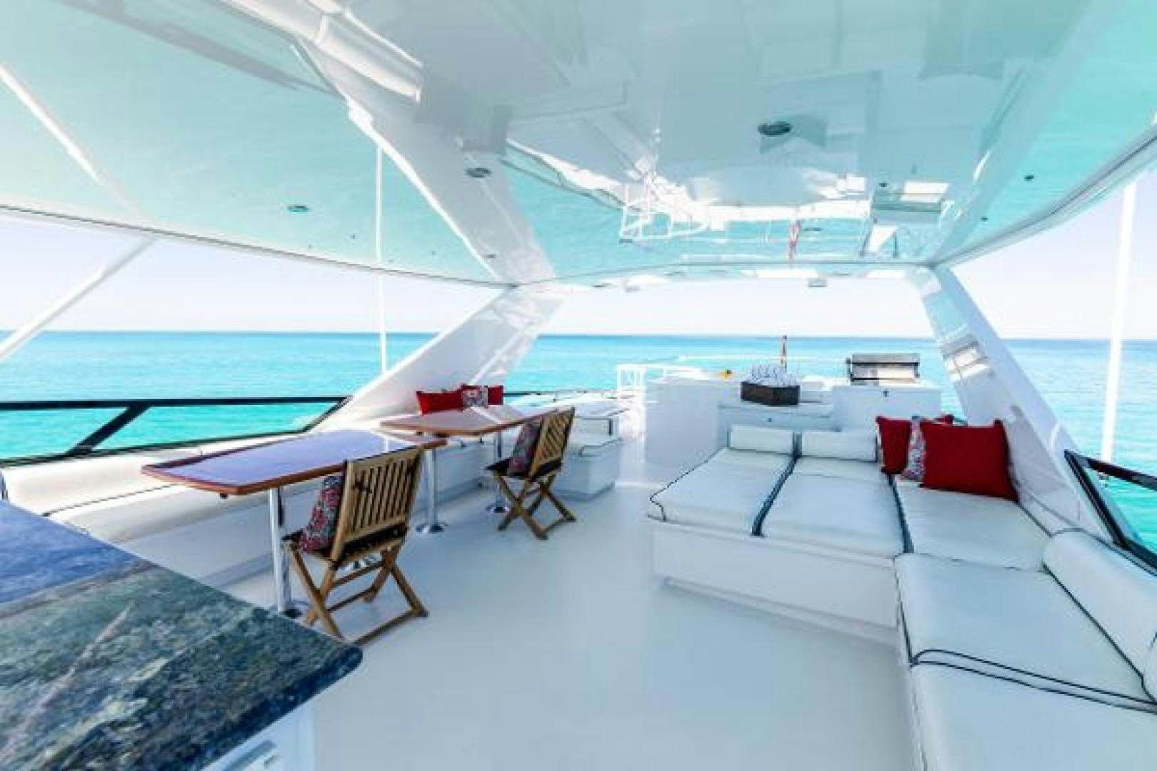 a room with a view of the ocean and a boat aboard IL CAPO Yacht for Sale