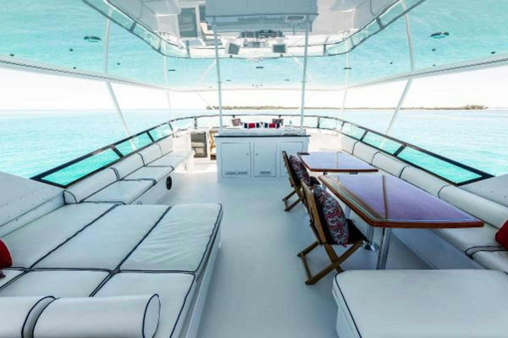 a room with a table and chairs aboard IL CAPO Yacht for Sale