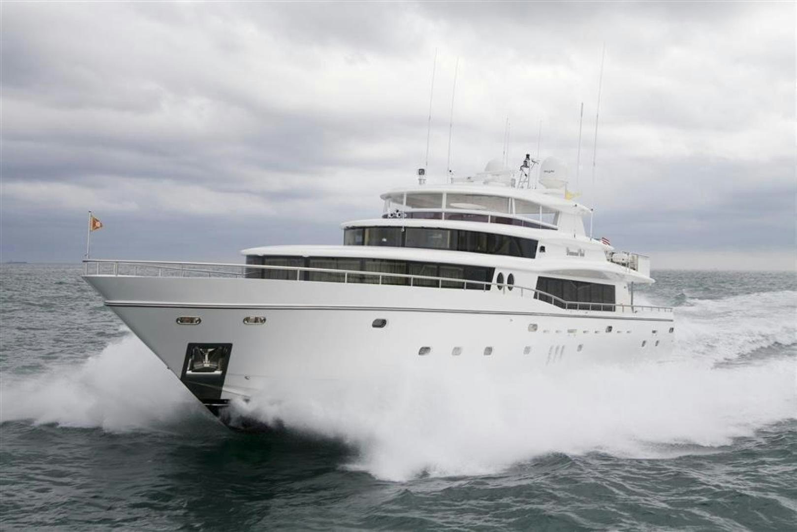 a white boat in the water aboard JOHNSON 110 FLYBRIDGE Yacht for Sale