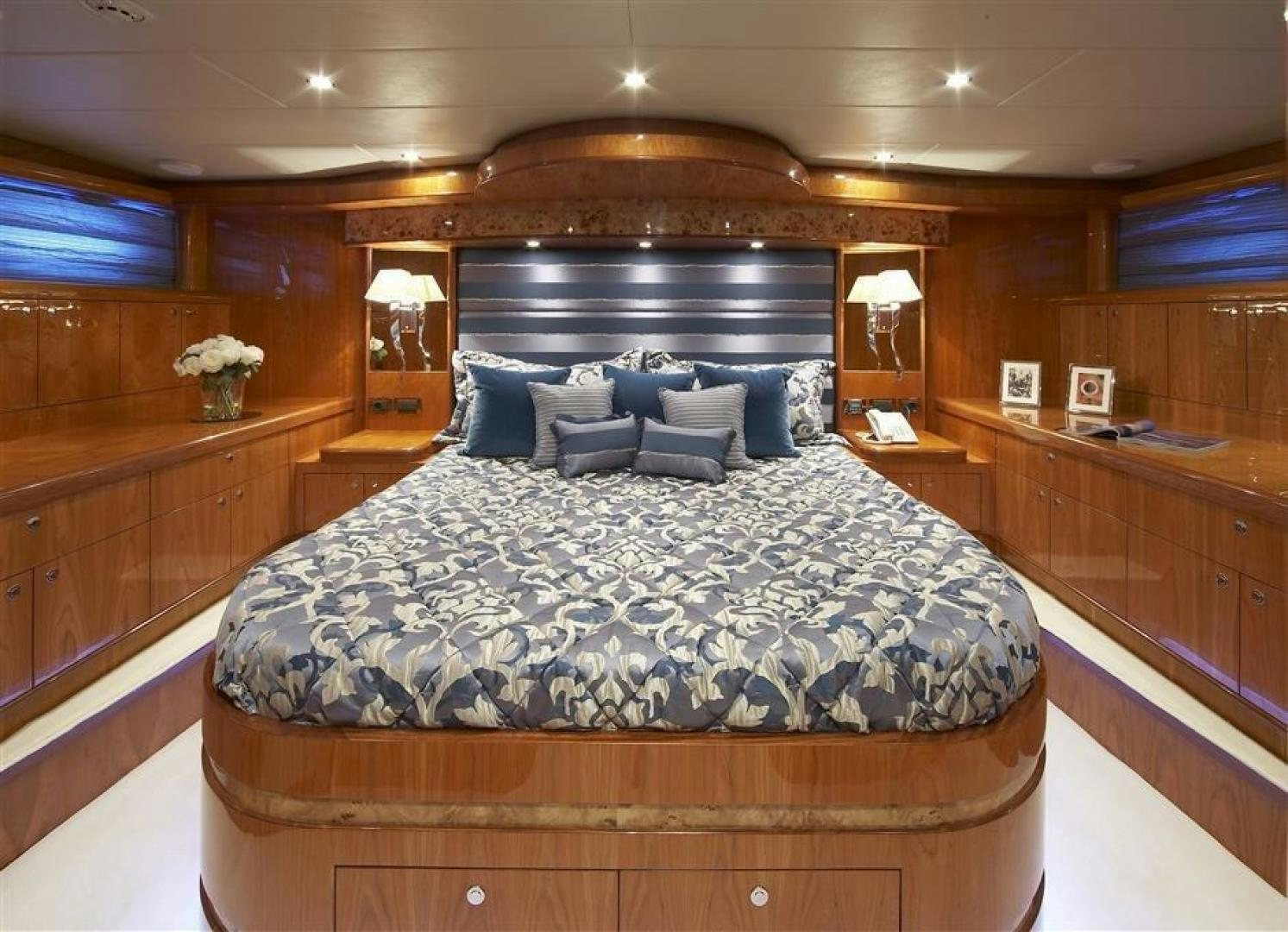 a large bed in a room aboard JOHNSON 110 FLYBRIDGE Yacht for Sale