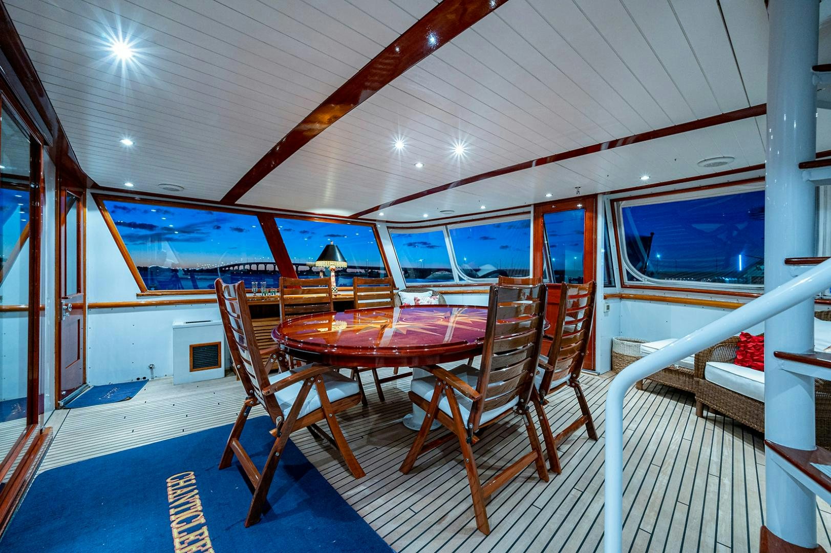 a room with a table and chairs aboard CHANTICLEER Yacht for Sale