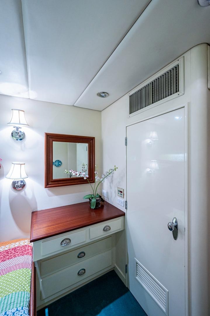 a room with a mirror and a dresser aboard CHANTICLEER Yacht for Sale