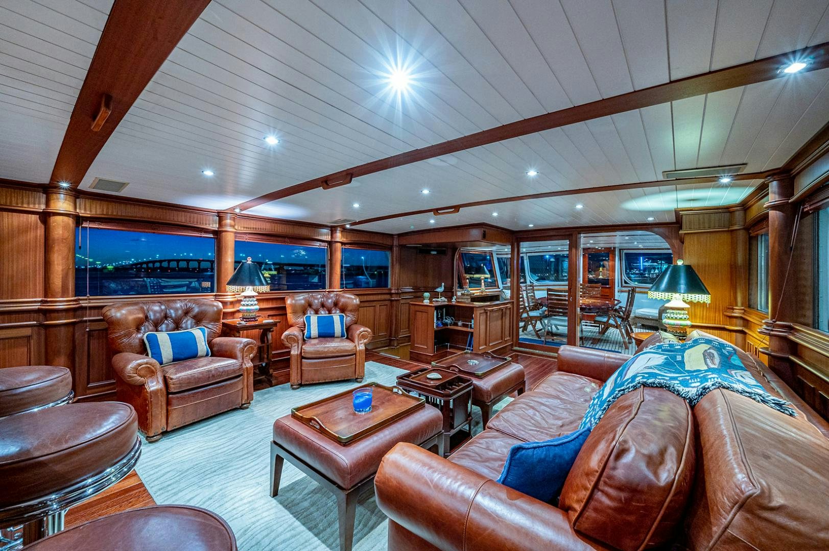 a living room with a large mirror aboard CHANTICLEER Yacht for Sale