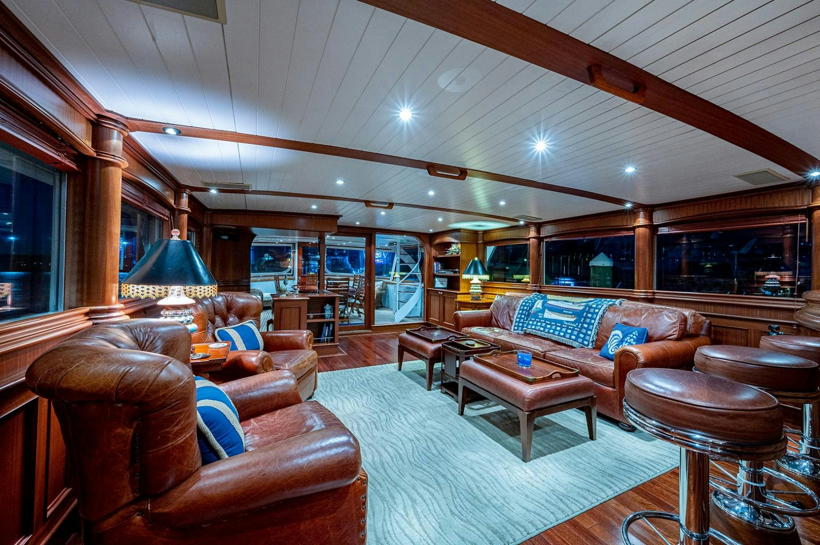 a living room with a large open ceiling aboard CHANTICLEER Yacht for Sale