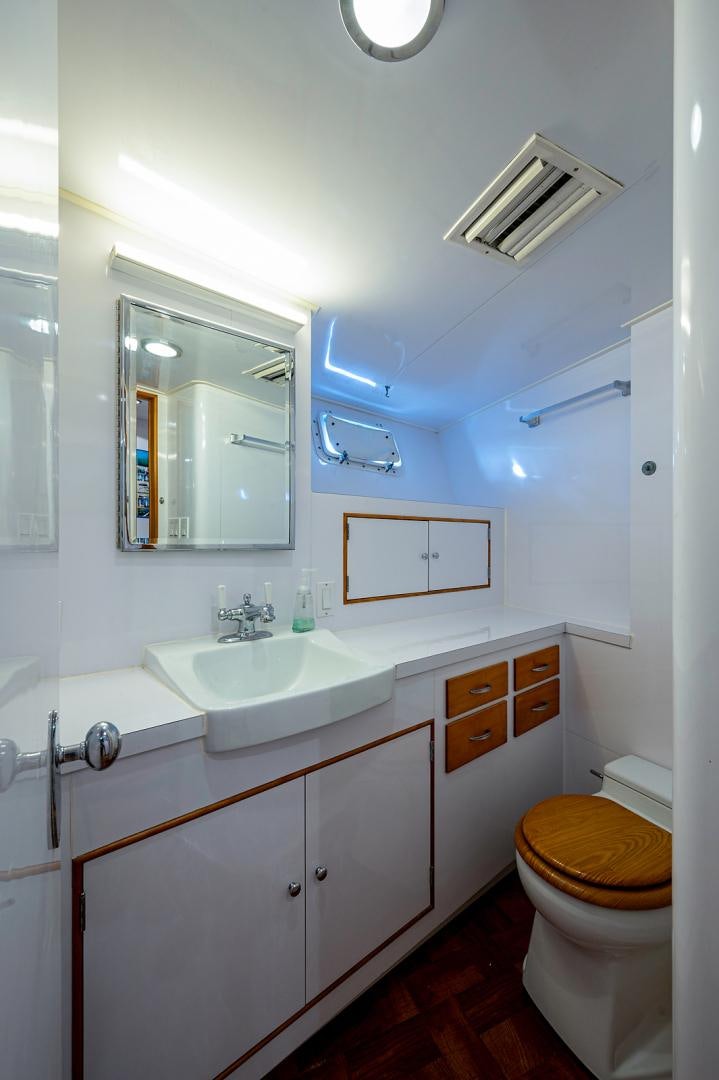 a bathroom with a sink and a toilet aboard CHANTICLEER Yacht for Sale