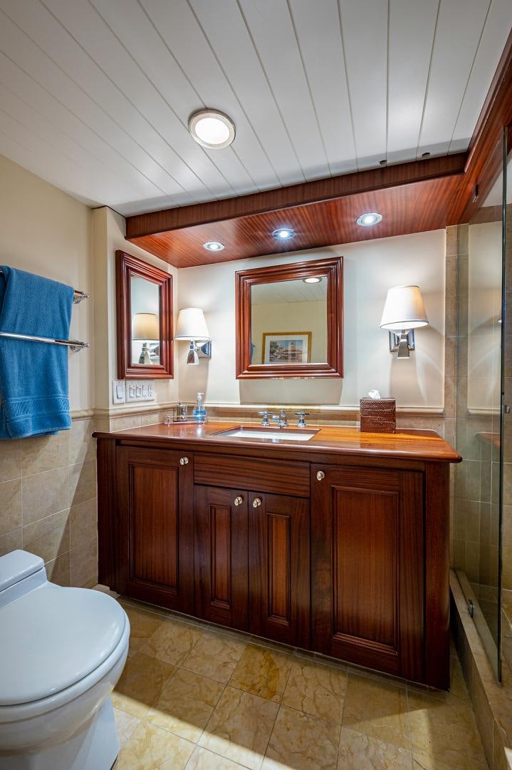 a bathroom with a sink and a toilet aboard CHANTICLEER Yacht for Sale