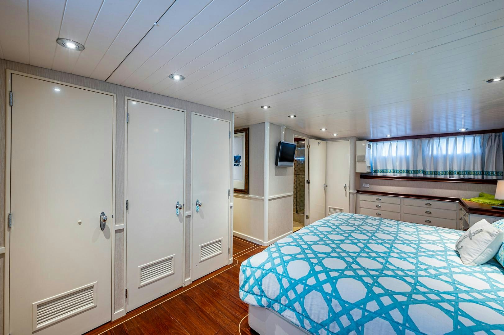 a large room with a blue rug aboard CHANTICLEER Yacht for Sale