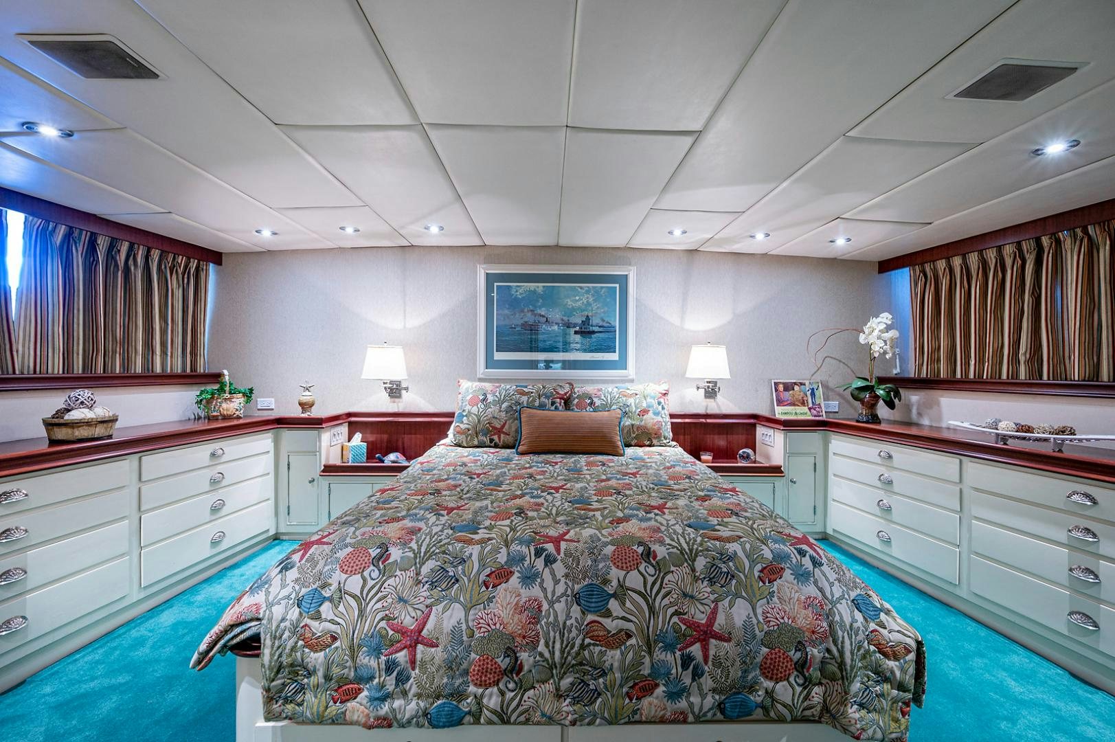 a bedroom with a large bed aboard CHANTICLEER Yacht for Sale