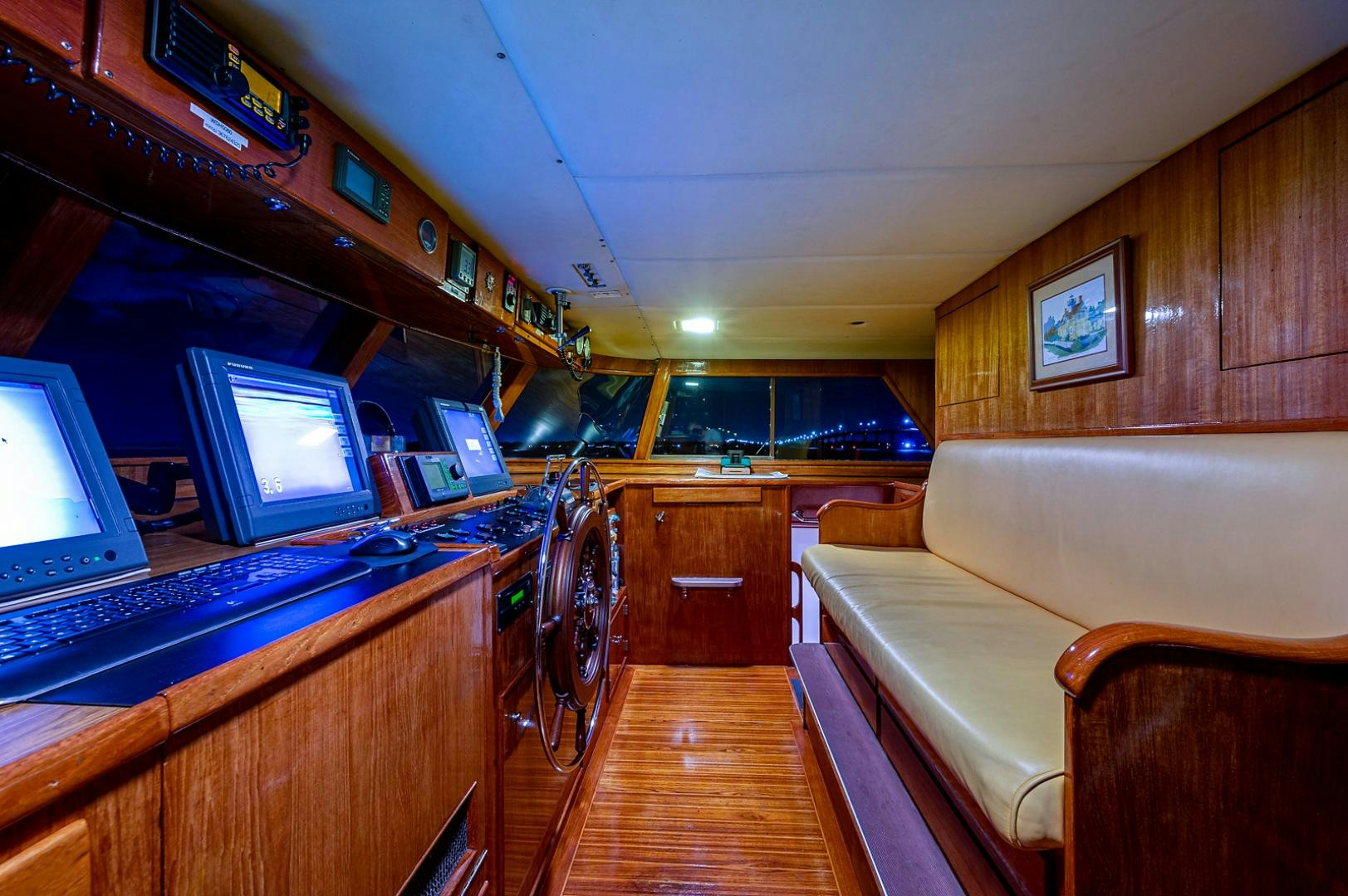 a room with a couch and laptops aboard CHANTICLEER Yacht for Sale