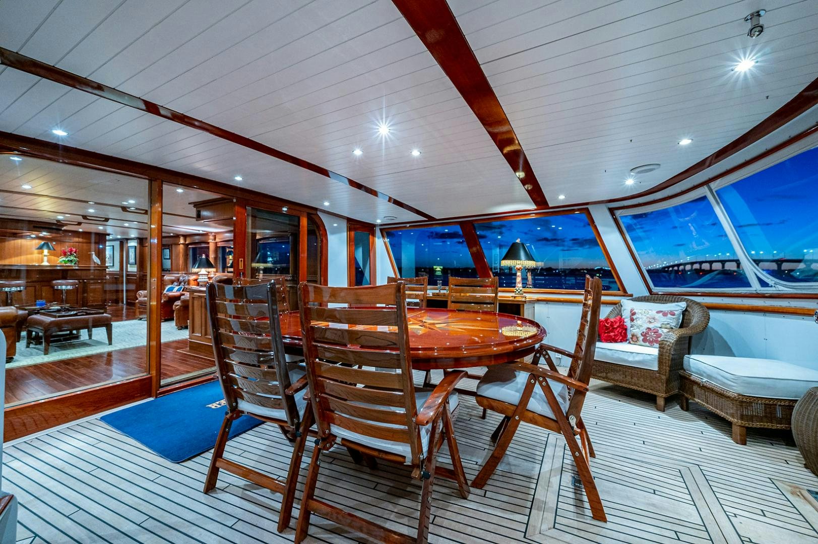 a room with a table and chairs aboard CHANTICLEER Yacht for Sale