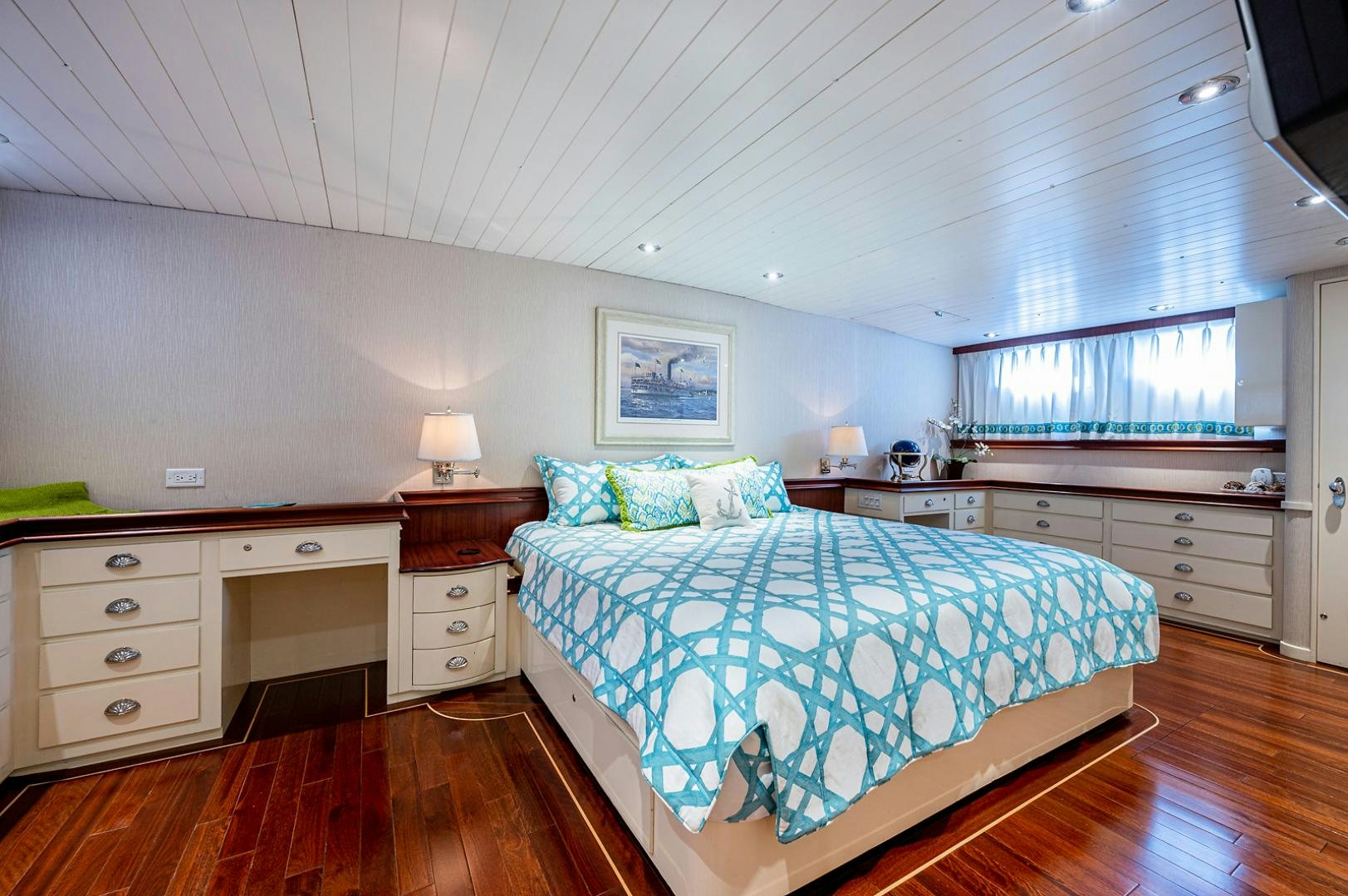 a bedroom with a large bed aboard CHANTICLEER Yacht for Sale