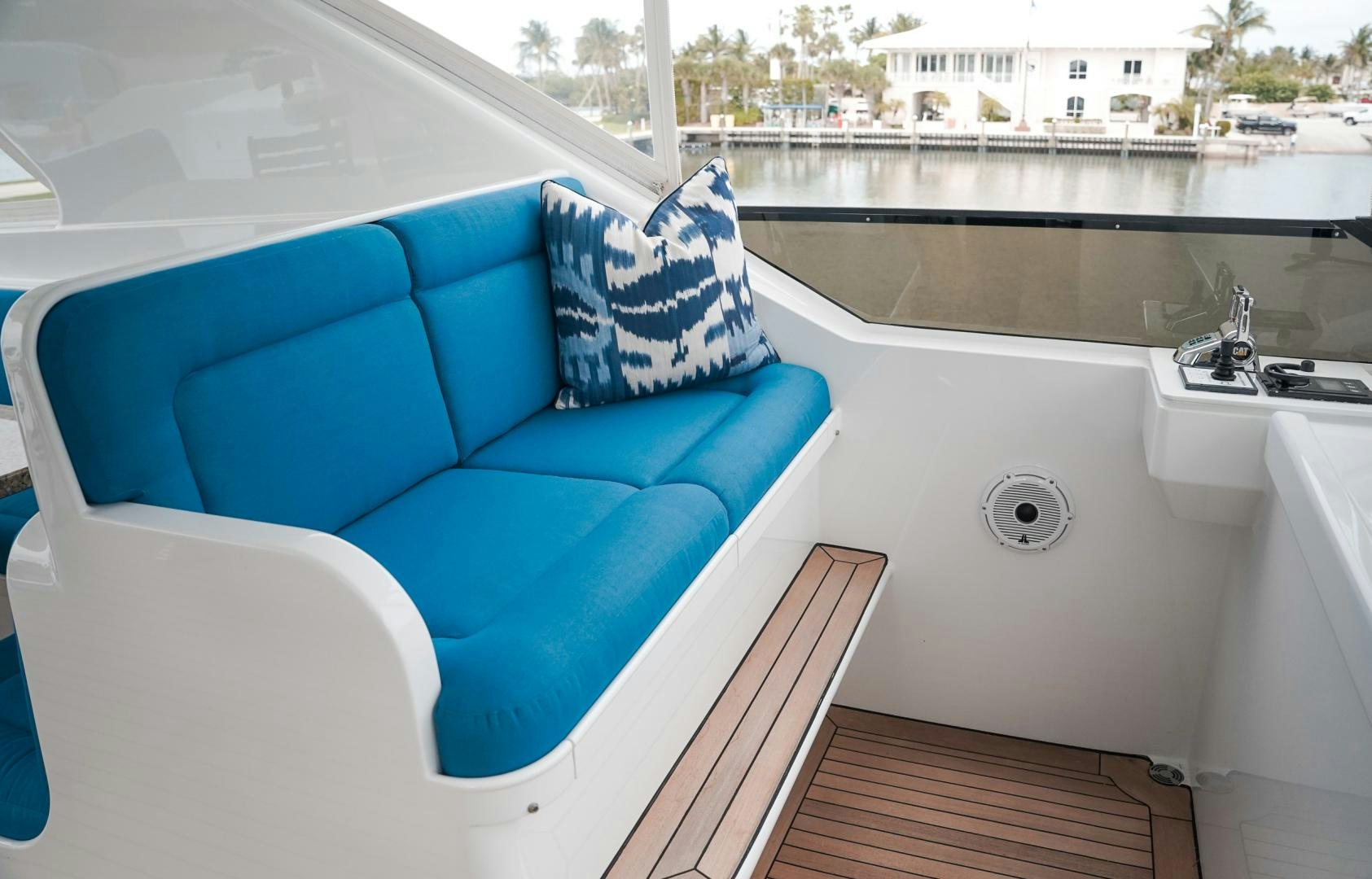 a bathtub and a couch in a room with a window aboard RAISING DOUGH Yacht for Sale