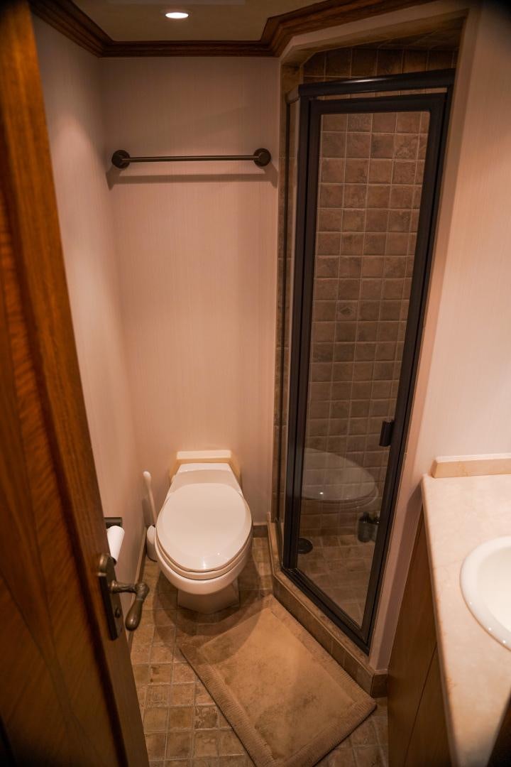 a bathroom with a toilet and sink aboard RAISING DOUGH Yacht for Sale