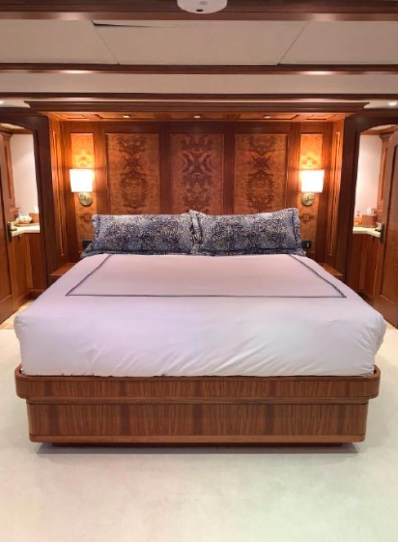 a bed with a white sheet aboard RAISING DOUGH Yacht for Sale