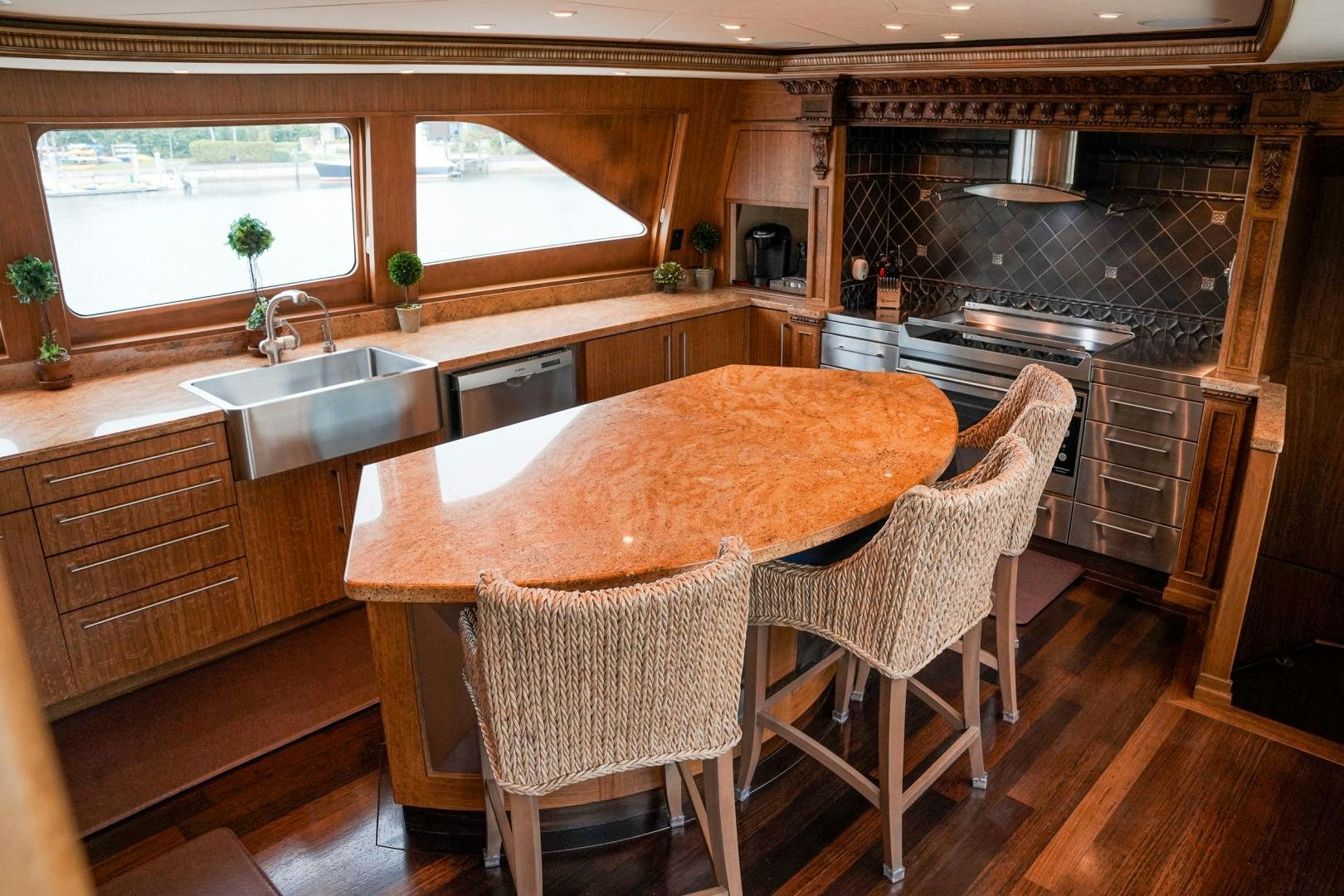 a kitchen with a large island aboard RAISING DOUGH Yacht for Sale