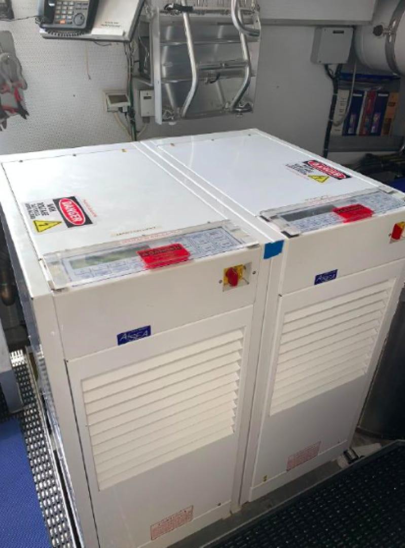 a white refrigerator with magnets on it aboard RAISING DOUGH Yacht for Sale